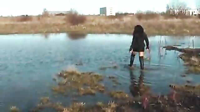 Black thigh high boots in the mud