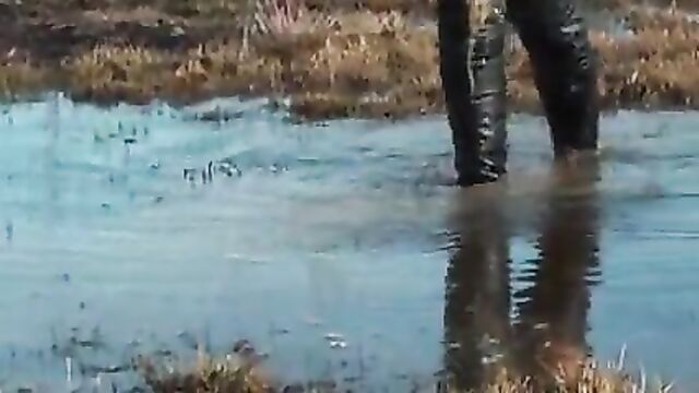 Black thigh high boots in the mud