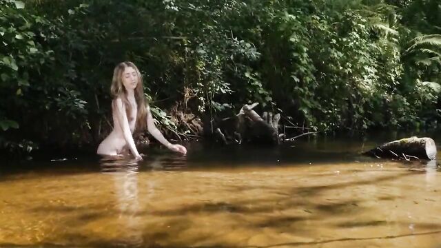 young teen nymph fairy Lada at a river