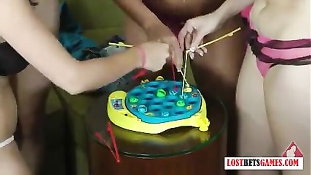 4 babes play a game of Fish, loser strips and faces punishme