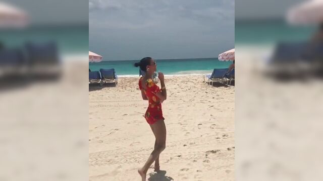 Victoria Justice dancing on the beach