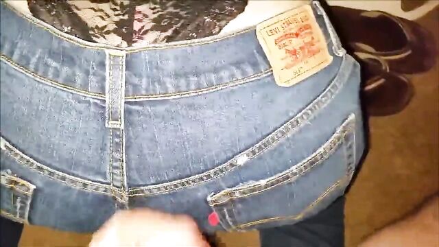 Releasing a load of cum on her jeans