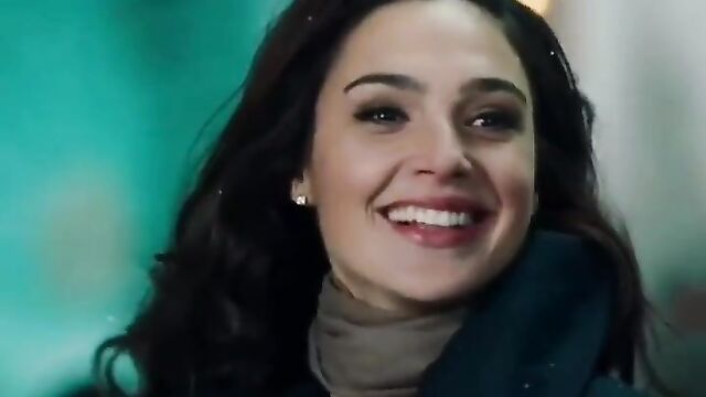 Gal Gadot outside at Christmas time.