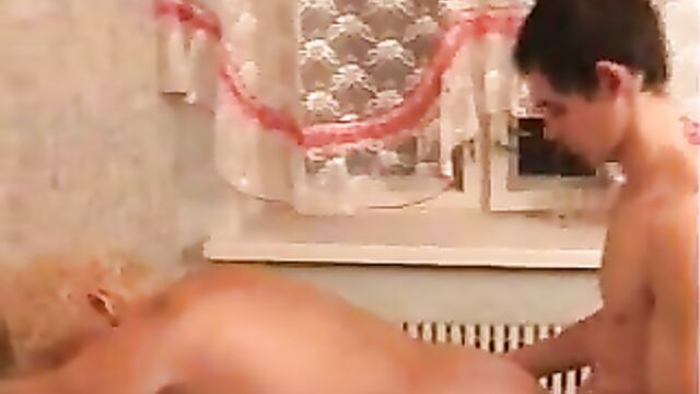 Russian granny Margo fucks young apartment in the kitchen