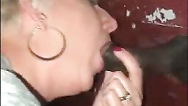 Wife sucks BBC at the gloryhole