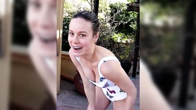 Brie Larson cleavage in white swimsuit