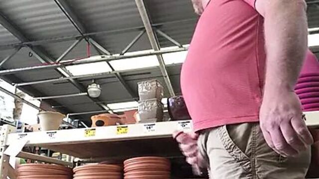 Bear public cum in a hardware store