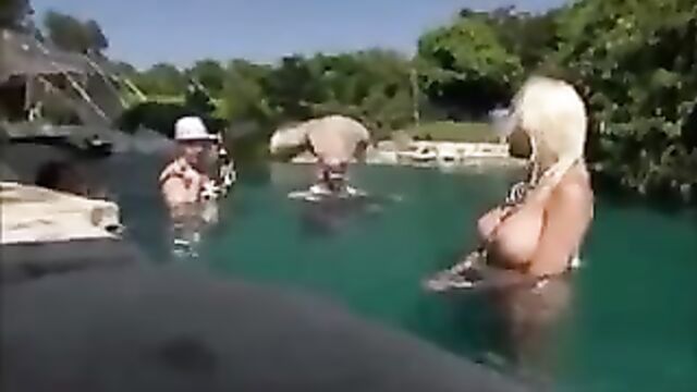 big breasted blonde under water.
