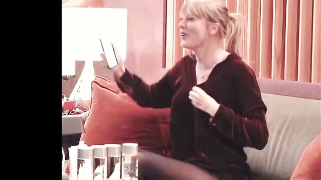 Taylor Swift bouncing on sofa