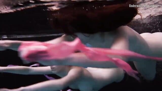 Andrejka and Aneta swim naked in the swimming pool