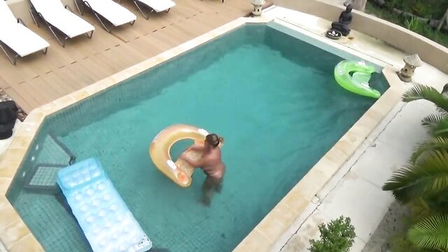 Nude swimming in the pool