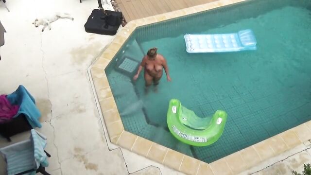 Nude swimming in the pool