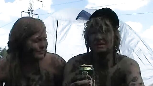 Topless Danish girl covered in mud at Roskilde Festival