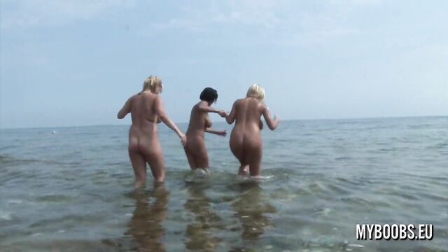 Three Busty teens naked on Public beach