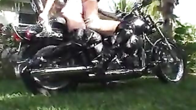 2 girls revving motorcycle in boots
