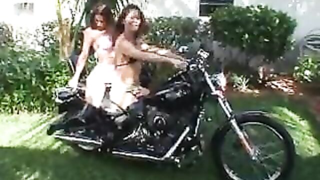 2 girls revving motorcycle in boots