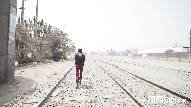 Petite Venezuelan model is approached by Peruvian near train