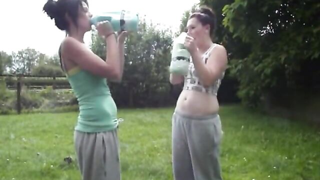 Two hot babes with big belly's do the milk challenge...