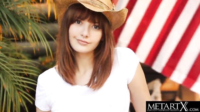 American beauty in a stetson hat strokes her perfect pussy