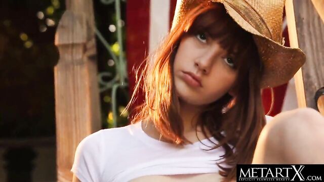 American beauty in a stetson hat strokes her perfect pussy