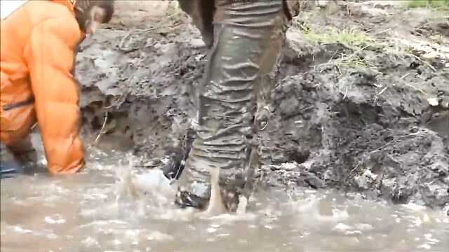 Three Girls in Mud in Winter Clothes