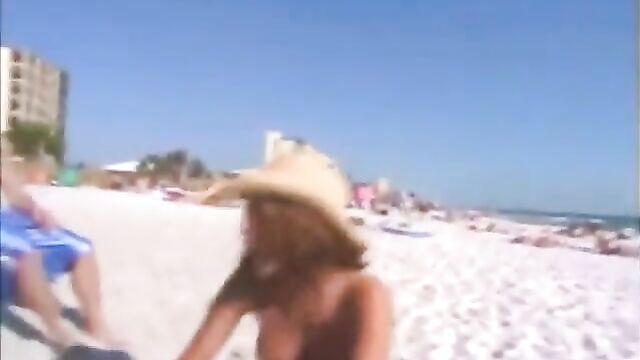 Girl gets naked in front of friends on a beach