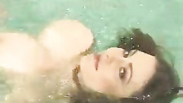 Hung tit babe swims in pool then shows off her tits and fuckholes