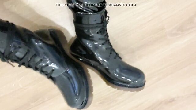 Guy in shiny pvc pants and gloss boots