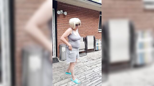Hot blonde milf dances nude for voyeur neighbors to watch
