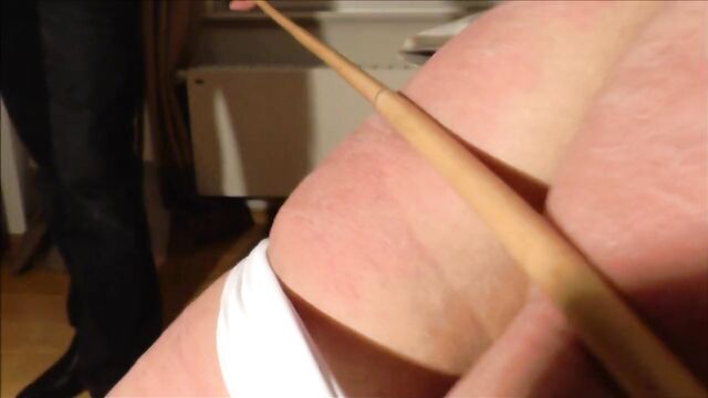Vigorous caning, knickers down