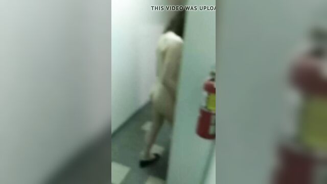 Taylor Morgan walks in her hallway naked