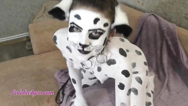 Beautiful Girl In Dalmatian Costume Playfully Rides Cavalier