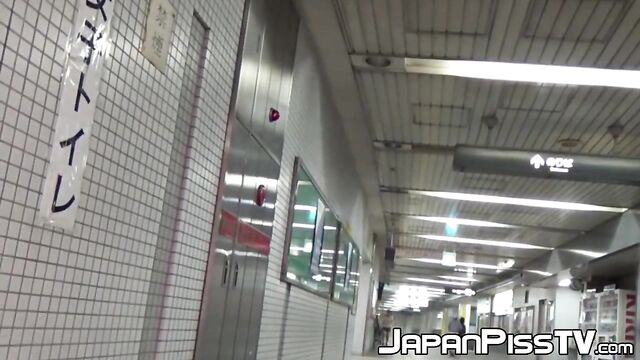 Japanese ladies taped pissing in public bathroom