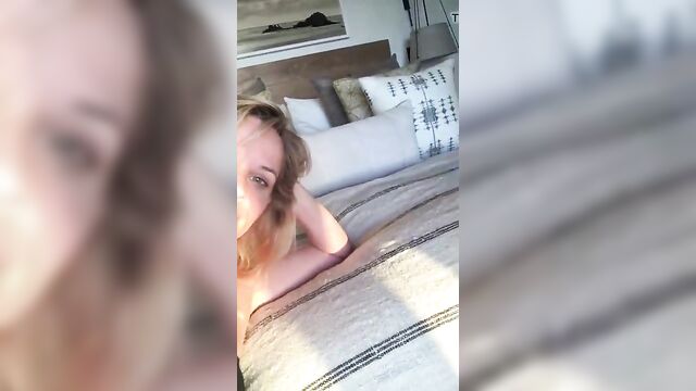 Reese Witherspoon laying on her bed, selfie vid