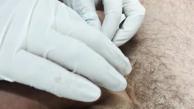 Piercing of the scrotum