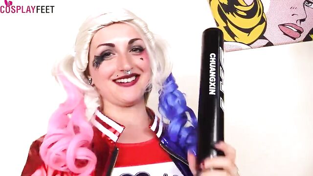 Two Harley Quinn cosplayers show feet in pantyhose