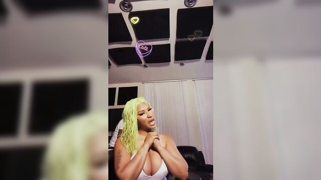 Nicki Minaj playing with her giant boobs, has nipple slip