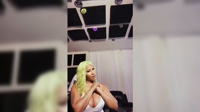 Nicki Minaj playing with her giant boobs, has nipple slip