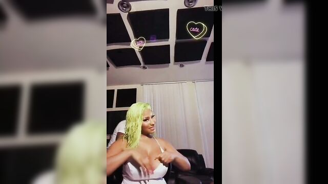 Nicki Minaj playing with her giant boobs, has nipple slip