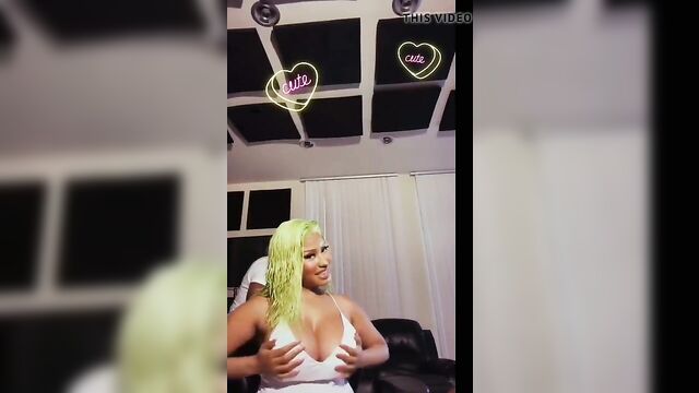 Nicki Minaj playing with her giant boobs, has nipple slip