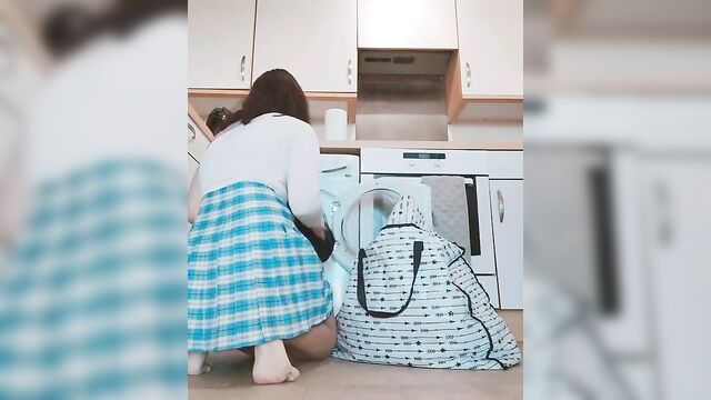 Asian chick showing her Asian pussy while doing her laundry