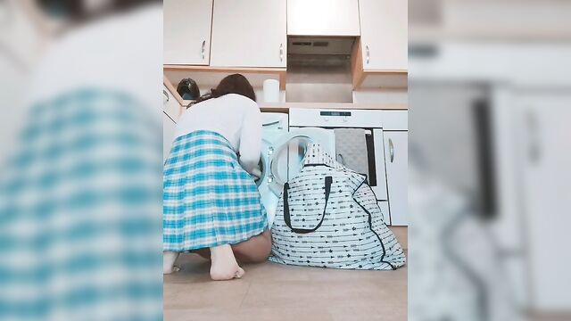 Asian chick showing her Asian pussy while doing her laundry