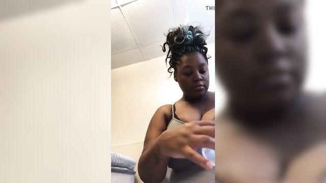 Busty Ebony squeezes milk out of giant tits