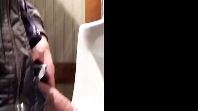 Huge cock caught on film at urinal