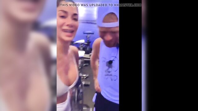 Nicole Scherzinger in gym showing big cleavage in white top