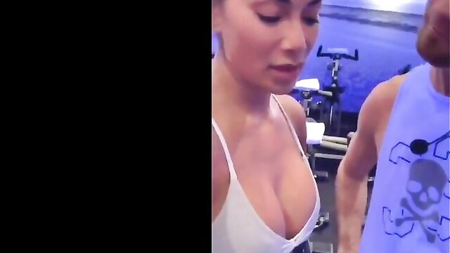 Nicole Scherzinger in gym showing big cleavage in white top