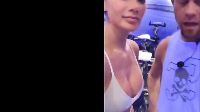 Nicole Scherzinger in gym showing big cleavage in white top