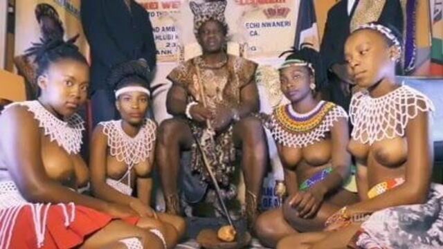 African chief with his own topless girls