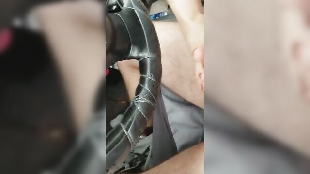 Friend gives footjob in car.