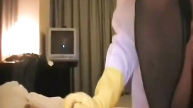 Asian Nurse in Yellow Rubber Gloves Gives a Handjob